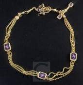 An early 20th century gold triple strand Albertina ropetwist chain, with floral enamelled plaques,