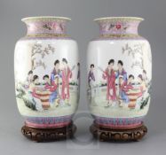 A pair of Chinese famille rose lantern shaped vases, painted with beautiful ladies amid pavilion