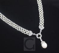 An attractive multi seed pearl necklace with white gold baroque pearl and diamond drop pendant