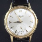 A gentleman's 1950's 18ct gold Longines manual wind wrist watch, with arrowhead markers and