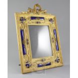 An early 20th century French blue enamel and ormolu photograph frame, of ornate design, with