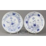 A near pair of Chinese blue and white 'mandarin duck and pond' saucer dishes, Yongzheng mark and