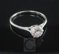 A platinum and solitaire diamond ring, the round brilliant cut stone weighing approximately 0.70cts,