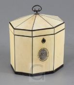 A Regency ebony strung ivory tea caddy, of octagonal form with monogrammed silver plaque and