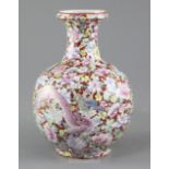 A Chinese coral ground 'dragon' bottle vase, Qianlong seal mark, early 20th century, finely