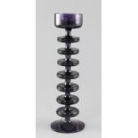 Ronald Stennett-Willson for Wedgwood. A Sheringham seven disc purple glass candlestick, 26.8cm