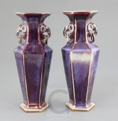 A pair of Chinese flambe glazed hexagonal baluster vases, 19th / early 20th century, the necks