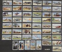 Four folio albums of cigarette cards on topographical themes, Buildings, Monuments, etc., mainly