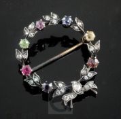 A 19th century gold and silver, rose cut diamond and multi coloured gem set circular garland brooch,