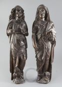 A pair of 16th century Flemish / Dutch carved oak evangelists, portrayed holding gospels - St