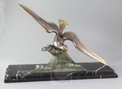 A. De Loury. An Art Deco bronze model of a seagull swooping above a wave, signed in the bronze, on