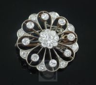 A Victorian style gold, platinum and diamond openwork circular pendant brooch, 26mm.