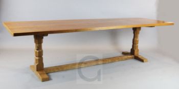 Robert 'Mouseman' Thompson. A golden oak refectory table, with adzed top, on octagonal turned end