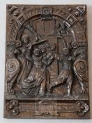 A 17th century German oak panel, carved with the Prodigal Son, chased from the inn by harlots,