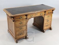 Attributed to Gillows. A Victorian gothic revival rosewood pedestal desk, with tooled brown skiver