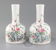 A pair of Chinese famille rose mallet-shaped vases, 19th century, each painted with birds amid