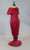 A rare Mariano Fortuny rose red finely pleated Delphos three quarter length tunic and matching