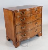 A good George III inlaid satinwood serpentine chest, the top with oval mahogany roundel, over two