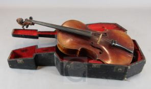An early 20th century cello, probably French, cased, body 29.5in., length overall 49in.