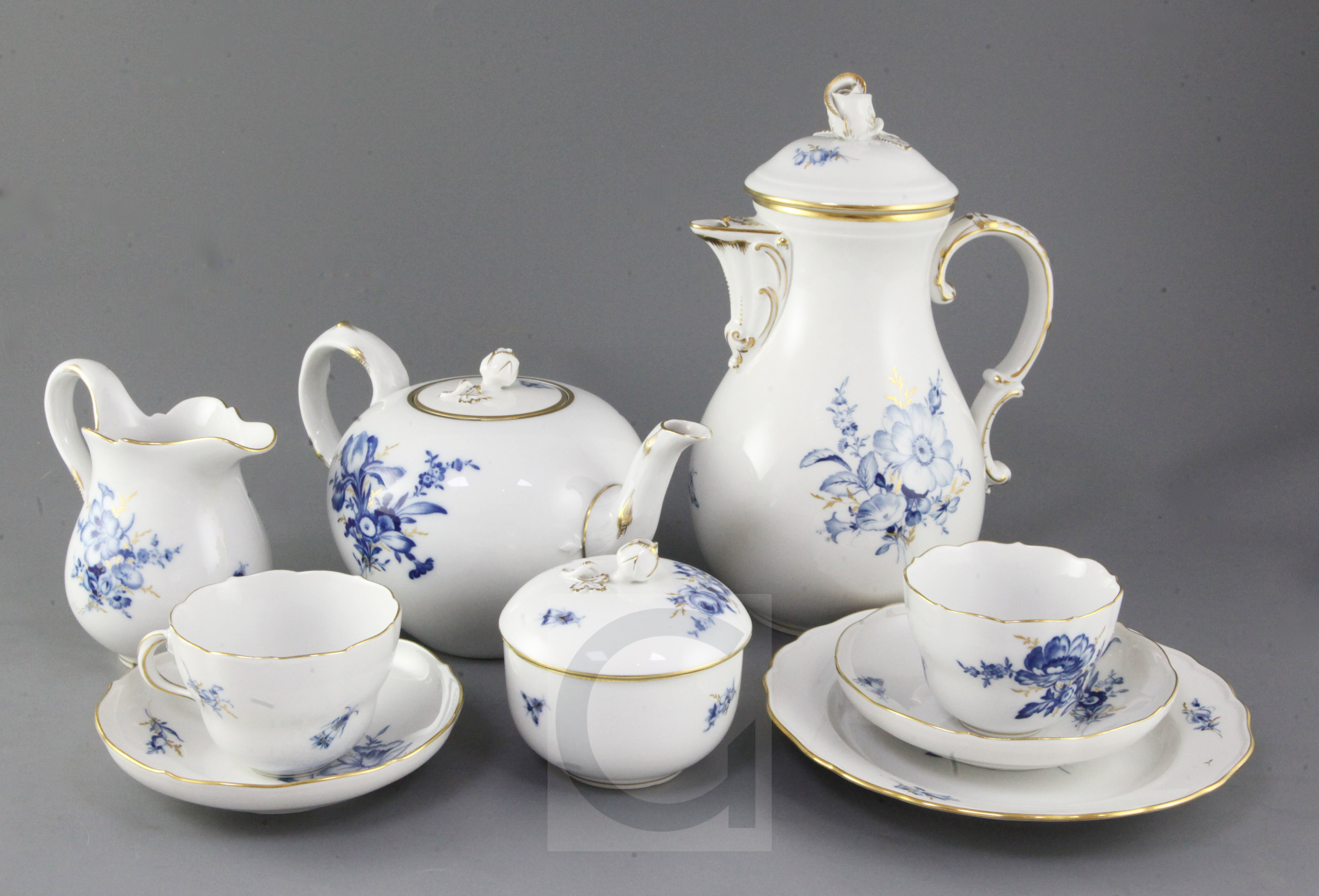 A Meissen blue and gilt decorated floral tea and coffee set for twelve place settings, 20th century,