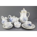 A Meissen blue and gilt decorated floral tea and coffee set for twelve place settings, 20th century,