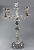 A late Victorian Elkington & Co large silver plated four branch, five light candelabrum, with scroll