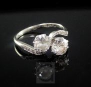 A mid 20th century 18ct white gold and platinum, two stone diamond crossover ring, with diamond