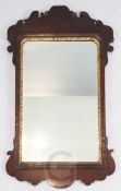 A George II walnut and parcel gilt fret framed wall mirror, W.2ft H.3ft 3in.