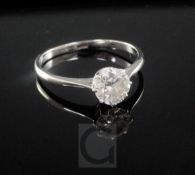 An 18ct white gold and solitaire diamond ring, the round brilliant cut stone weighing