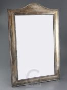 A late Victorian large silver mounted domed top rectangular easel mirror by Goldsmiths &