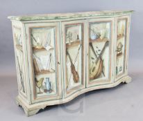A 20th century Italian painted serpentine side cabinet, decorated with clin d'oeil bookshelves, W.