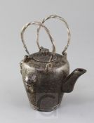 A Chinese iron temple teapot and cover, Qianlong mark and of the period, the ovoid body cast with