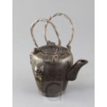 A Chinese iron temple teapot and cover, Qianlong mark and of the period, the ovoid body cast with