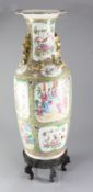 A large Chinese Canton-decorated famille rose baluster vase, 19th century, painted with figures amid