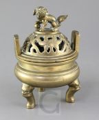 A Chinese bronze ding censer and cover, Xuande mark, late 19th century, on zoomorphic legs, the