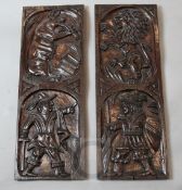 A pair of 18th century oak panels, one carved with a pig playing a shawm, the other with a lion,