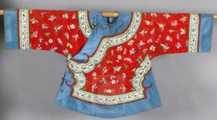 A Chinese embroidered silk red brocade jacket, late Qing dynasty, embroidered with birds,
