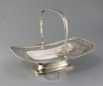 A George III silver swing handled cake basket, with gadrooned edge, London 1804, maker probably