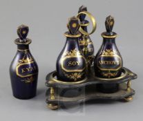 A Regency gilt decorated blue glass three bottle cruet stand, the bottles titled 'Soy', 'Ketchup'