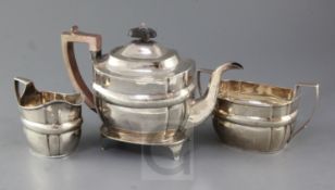 A George III silver four piece tea set by Urquhart & Hart, with engraved decoration, comprising