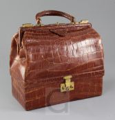 A 1930's Hermes of Paris crocodile handbag, with pale brown leather interior stamped Hermes Paris,