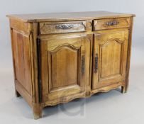 An 18th century French provincial walnut side cabinet, fitted two drawers and two panelled doors,