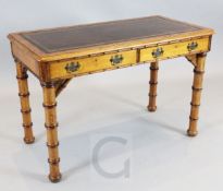 Howard & Sons. A Victorian pine writing table, with two drawers and simulated bamboo legs, drawer
