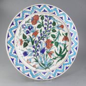 Theodore Deck. An Isnik style pottery charger, late 19th century, polychrome decorated with
