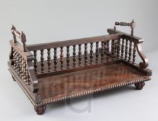 A Regency rosewood book rack, with turned spindles, 16in. depth 13in.