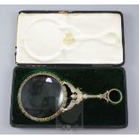 A late 19th century French parcel gilt silver magnifying glass, with angel handle, in a fitted box