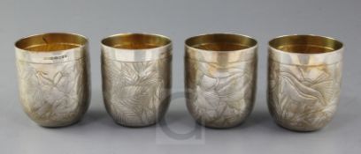A matched set of four modern silver tumblers by Rod A. Kelly, engraved with stylised foliate