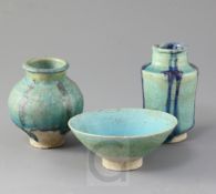 A Kashan turquoise glazed pottery bowl and two similar small jars, 13th century, the two jars with