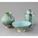 A Kashan turquoise glazed pottery bowl and two similar small jars, 13th century, the two jars with