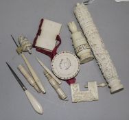 A carved ivory needlecase and needles, including a collection of other sewing items